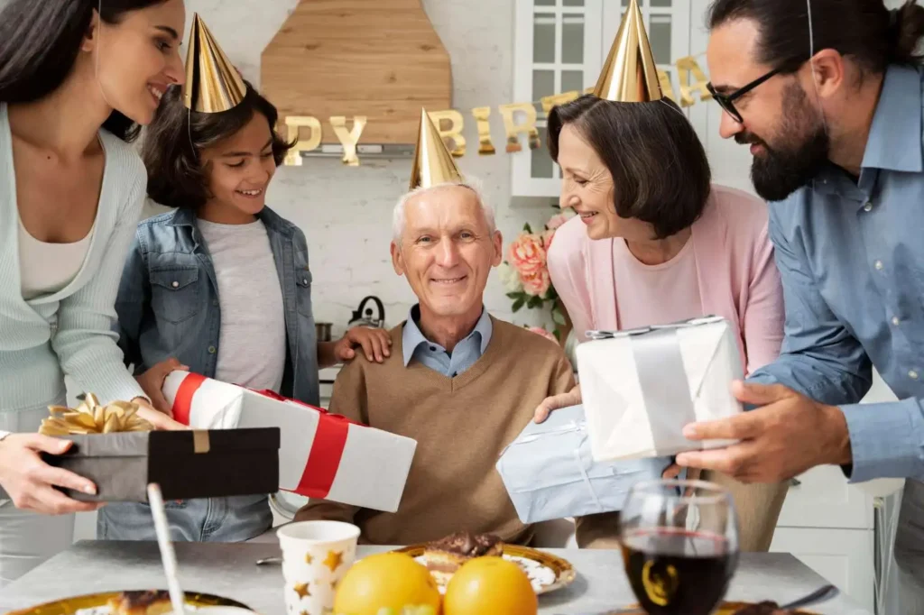 Celebration of Life Program featuring a family gathering around an elderly man with gifts and smiles